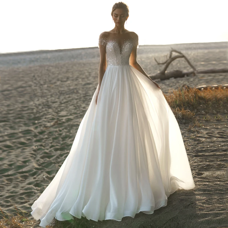Scoop See Through Top Beads Pearls Sequined Short Sleeve Buttons Tulle A-Line Boho Wedding Dress Bridal Gown Vestido De Noiva
Scoop See Through Top Beads Pearls Sequined Short Sleeve Buttons Tulle A-Line Boho Wedding Dress Bridal Gown Vestido De Noiva