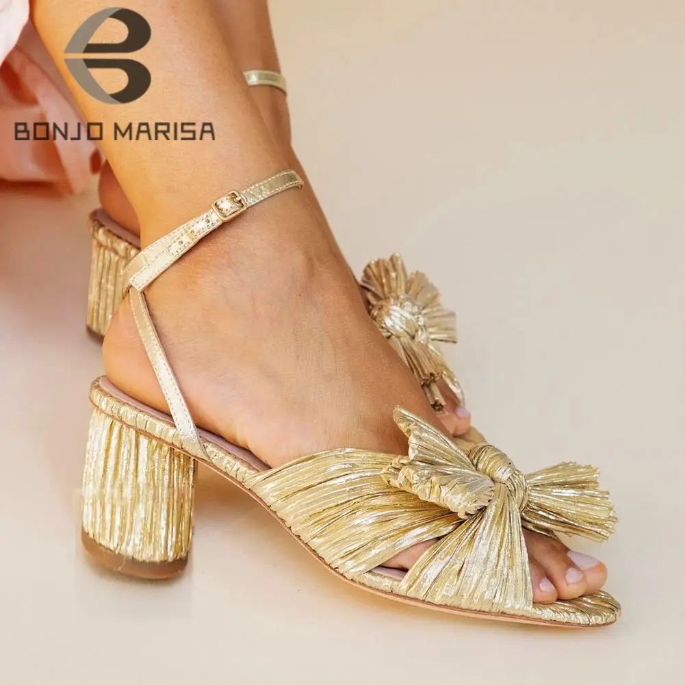 INS Open Toe Brand Designer Bowknot Gladiator Golden women's Sandals Luxury Wedding Dress Buckle High Heeled Pletaed Shoes Woman
INS Open Toe Brand Designer Bowknot Gladiator Golden women's Sandals Luxury Wedding Dress Buckle High Heeled Pletaed Shoes Woman