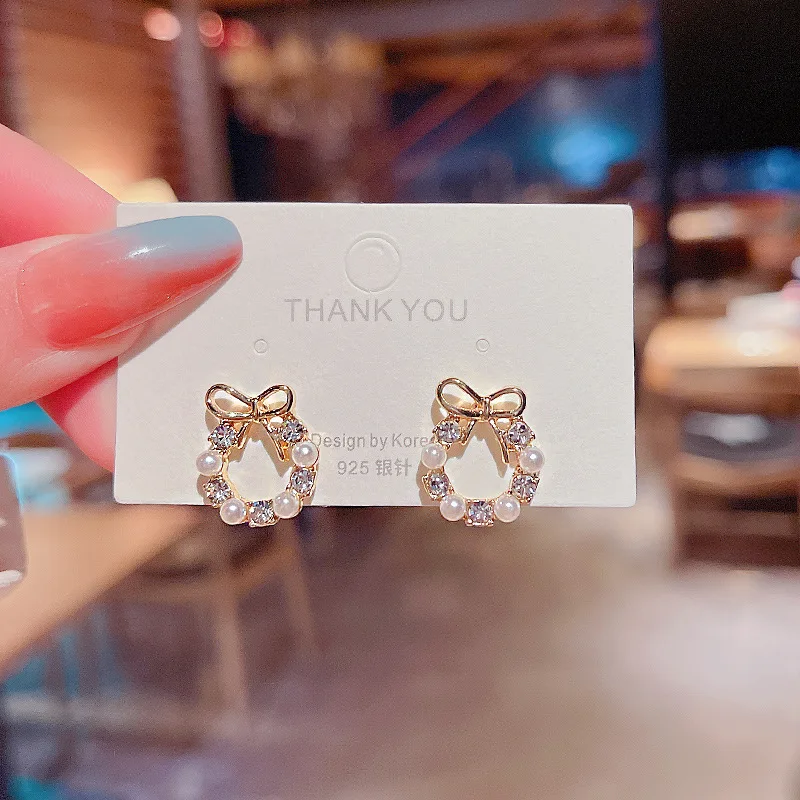 Korean version of the new bow zircon diamond pearl S925 silver needle earrings female fashion temperament earrings
Korean version of the new bow zircon diamond pearl S925 silver needle earrings female fashion temperament earrings
