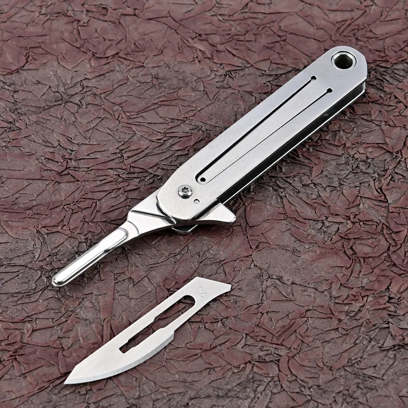 Stainless Steel Portable Mini Folding Knife Replaceable Blade Express Knife Utility Knife Keychain Hanging EDC Life Holiday Gift
Stainless Steel Portable Mini Folding Knife Replaceable Blade Express Knife Utility Knife Keychain Hanging EDC Life Holiday Gift