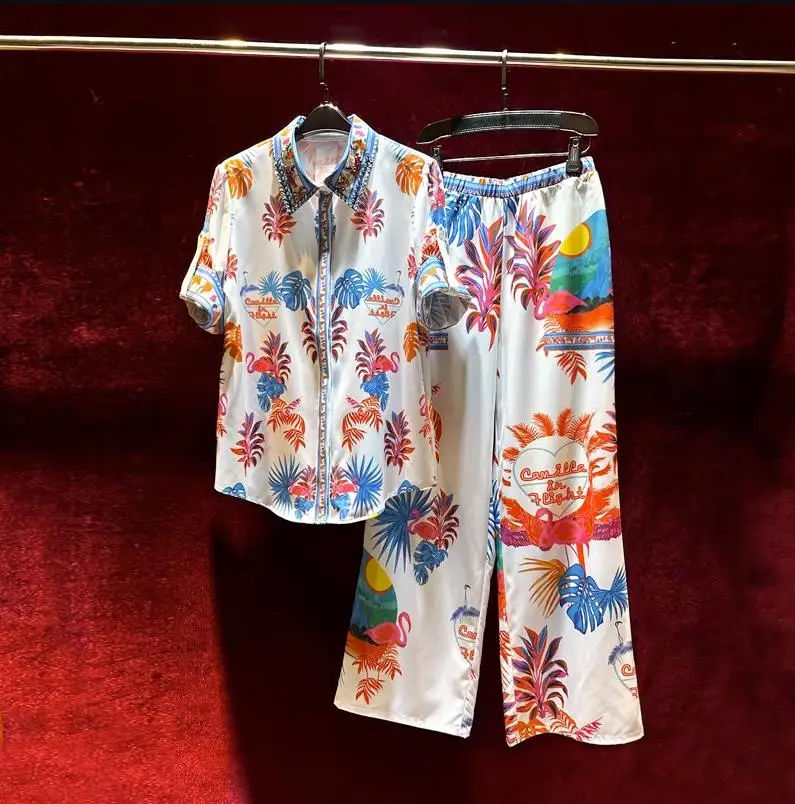 Женская одежда в европейском и американском стиле, Новинка лета 2023, рубашка с короткими рукавами и отворотами из бисера, модный костюм с широкими штанинами
Женская одежда в европейском и американском стиле, Новинка лета 2023, рубашка с короткими рукавами и отворотами из бисера, модный костюм с широкими штанинами