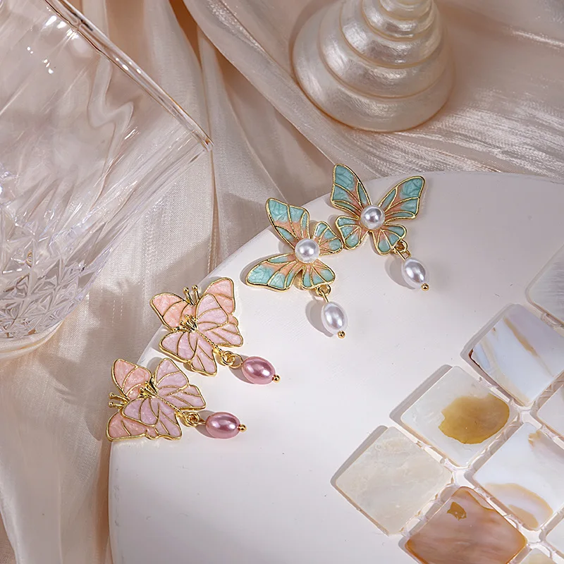 Minar Vintage Blue Pink Color Enamel Butterfly Earring for Women Imitation Pearl Simulation Wings Dangle Drop Earrings Oorbellen
Minar Vintage Blue Pink Color Enamel Butterfly Earring for Women Imitation Pearl Simulation Wings Dangle Drop Earrings Oorbellen