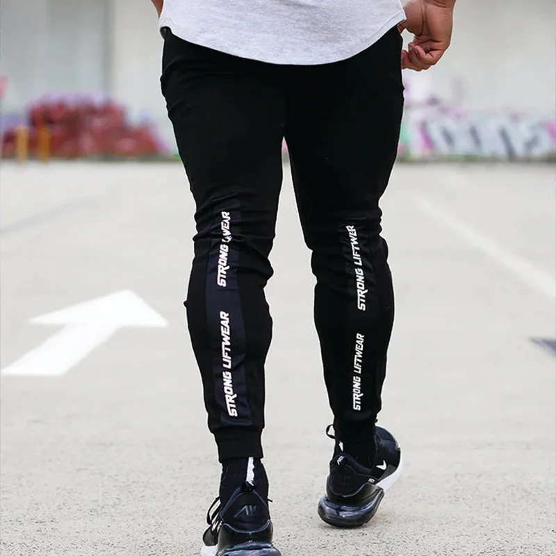 Men's muscle fitness new sports running training trousers outdoor casual pants trend pants cotton printing pencil pants 
Men's muscle fitness new sports running training trousers outdoor casual pants trend pants cotton printing pencil pants