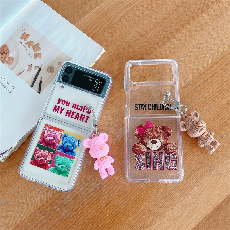 Lovely Bear Pendant Transparent Phone Case for Samsung Galaxy Z Flip 3 5G Hard PC Back Cover for ZFlip3 Cases Protective Shell
Lovely Bear Pendant Transparent Phone Case for Samsung Galaxy Z Flip 3 5G Hard PC Back Cover for ZFlip3 Cases Protective Shell