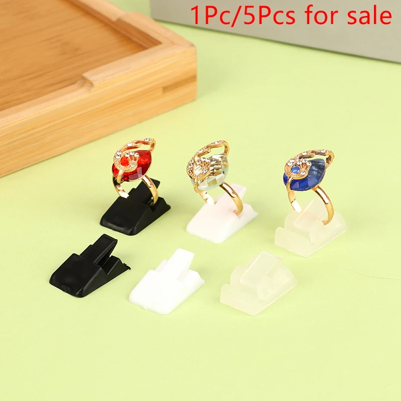 1/5Pcs Ring Holder Stand Ring Jewelry Display Rack Ring Storage Organizer Shelf Showcase Ring Decoration Clip Stand
1/5Pcs Ring Holder Stand Ring Jewelry Display Rack Ring Storage Organizer Shelf Showcase Ring Decoration Clip Stand