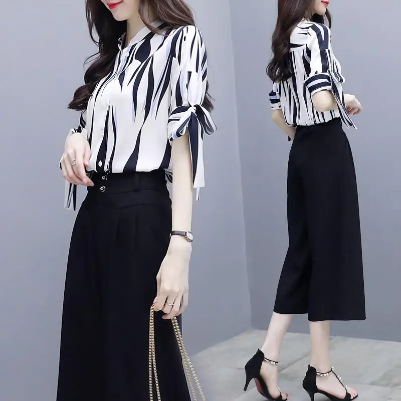 2022 Women Summer New Suits Female Short Sleeve Printed Blouses Tops and Loose Wide Leg Pants Ladies Clothing 2PCS Suit F193
2022 Women Summer New Suits Female Short Sleeve Printed Blouses Tops and Loose Wide Leg Pants Ladies Clothing 2PCS Suit F193