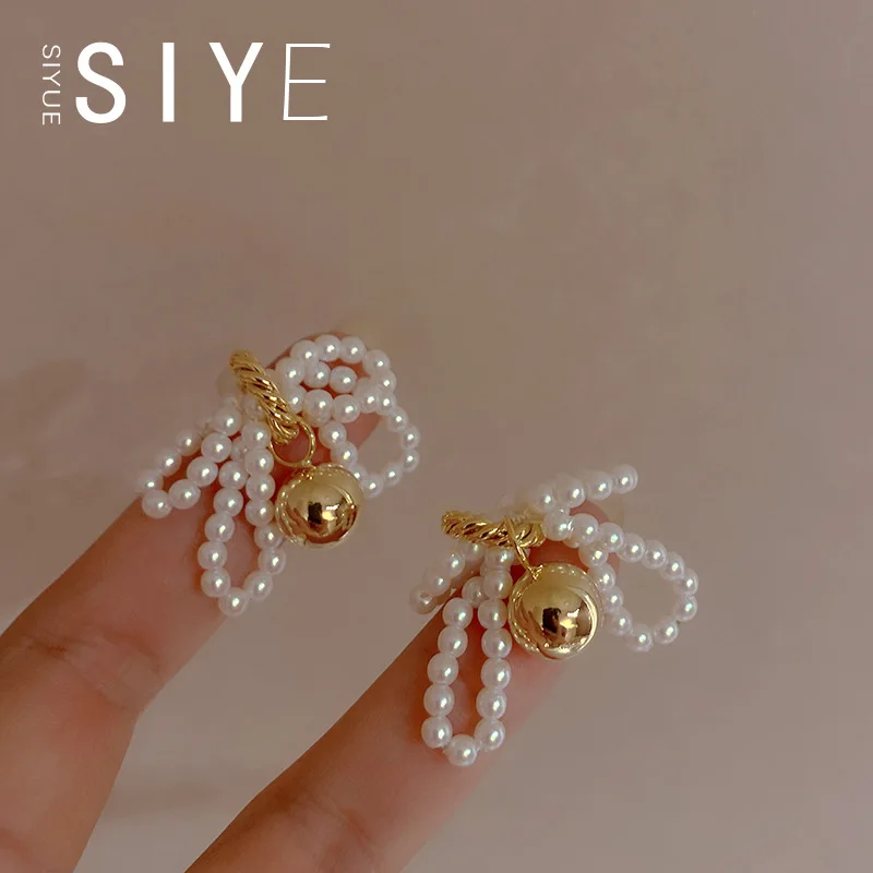 New Minimalist I Niche Design Sense Handmade Pearl Geometric Bow Bell Earrings Exaggerated Retro Fashionable Earrings Tide
New Minimalist I Niche Design Sense Handmade Pearl Geometric Bow Bell Earrings Exaggerated Retro Fashionable Earrings Tide