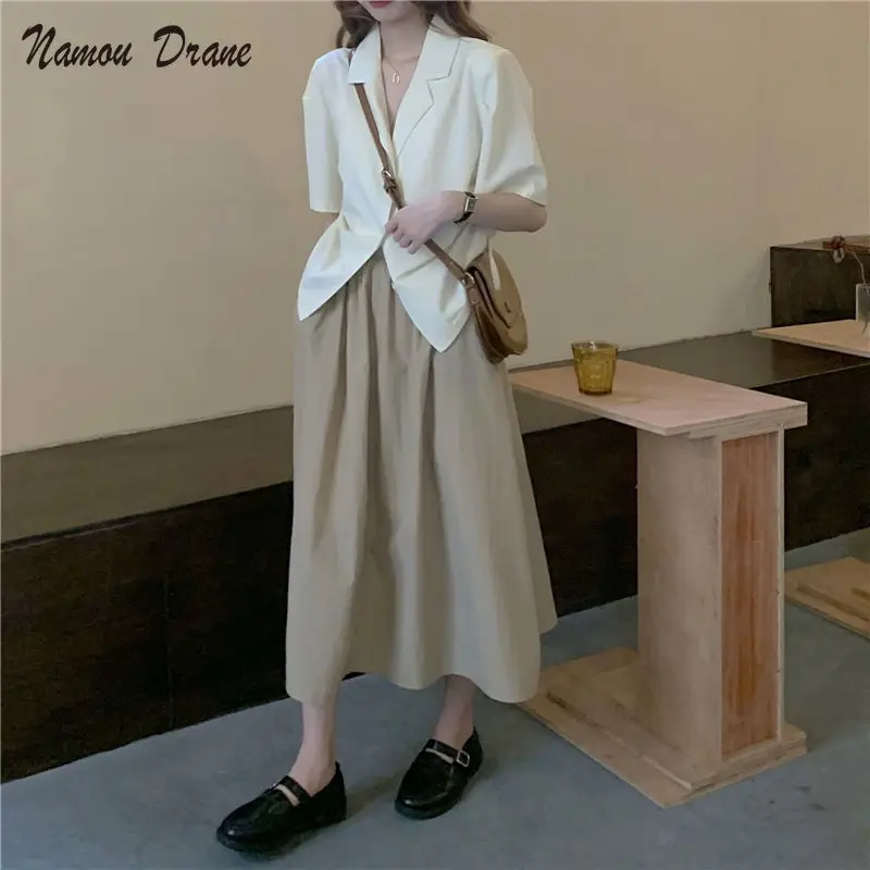 Suit Collar Short Sleeve Shirt Women's Summer Hong Kong Style Retro 2022 New Design Sense Drawstring Loose Short Sleeve Top
Suit Collar Short Sleeve Shirt Women's Summer Hong Kong Style Retro 2022 New Design Sense Drawstring Loose Short Sleeve Top
