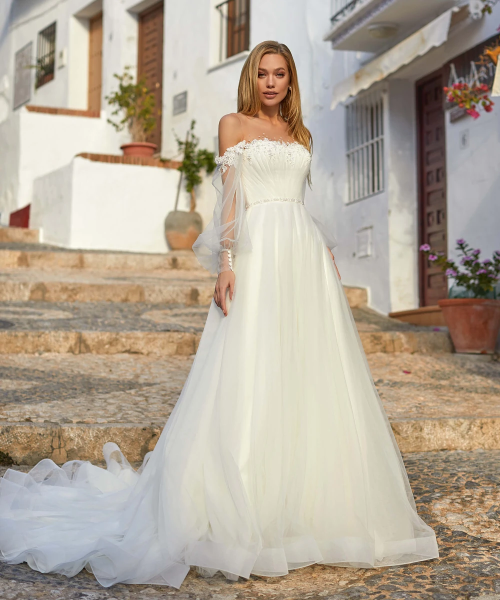 Romantic A Line Bridal Wedding Dresses Sexy Sheer Neck Prom Gowns for Bride Long Sleeves Appliqued Ruched Vestidos De Mariee 
Romantic A Line Bridal Wedding Dresses Sexy Sheer Neck Prom Gowns for Bride Long Sleeves Appliqued Ruched Vestidos De Mariee