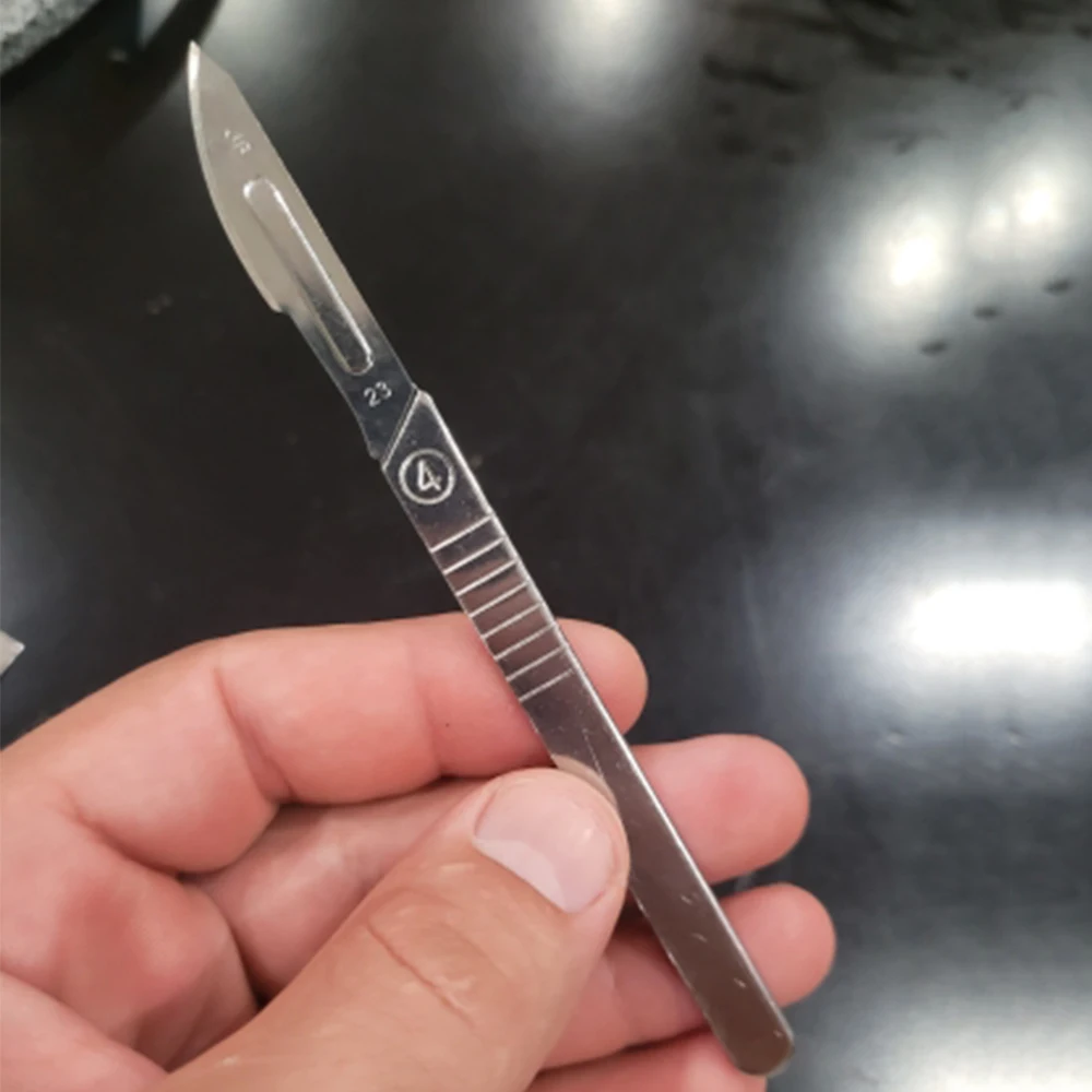 Carbon Steel Surgical Scalpel Blades 11# 23# With Handle Engraving Craft Knives Cutter Graver Screen Film DIY Cutting Hand Tool 
Carbon Steel Surgical Scalpel Blades 11# 23# With Handle Engraving Craft Knives Cutter Graver Screen Film DIY Cutting Hand Tool