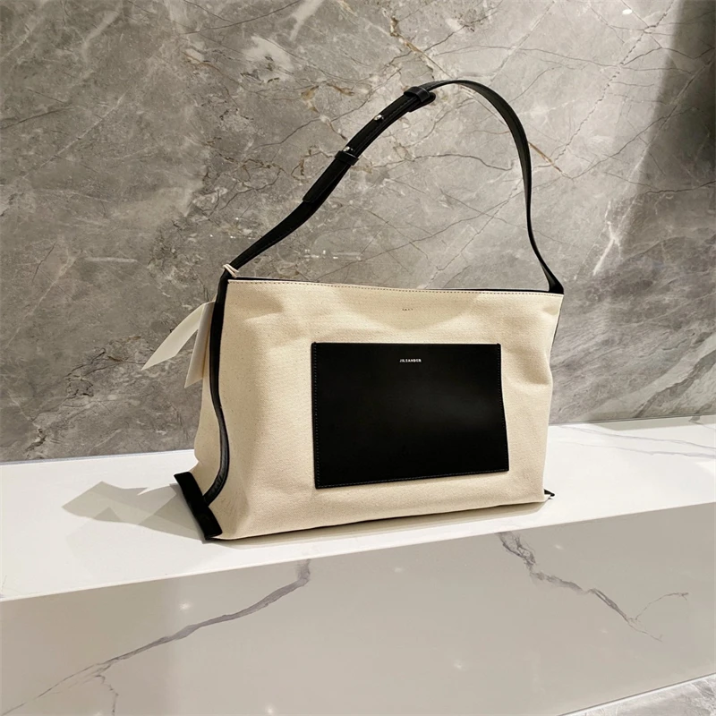 JIL minimalism style Large capacity cowhide canvas Tote bag small luxury brand single shoulder crossbody shopping bag
JIL minimalism style Large capacity cowhide canvas Tote bag small luxury brand single shoulder crossbody shopping bag