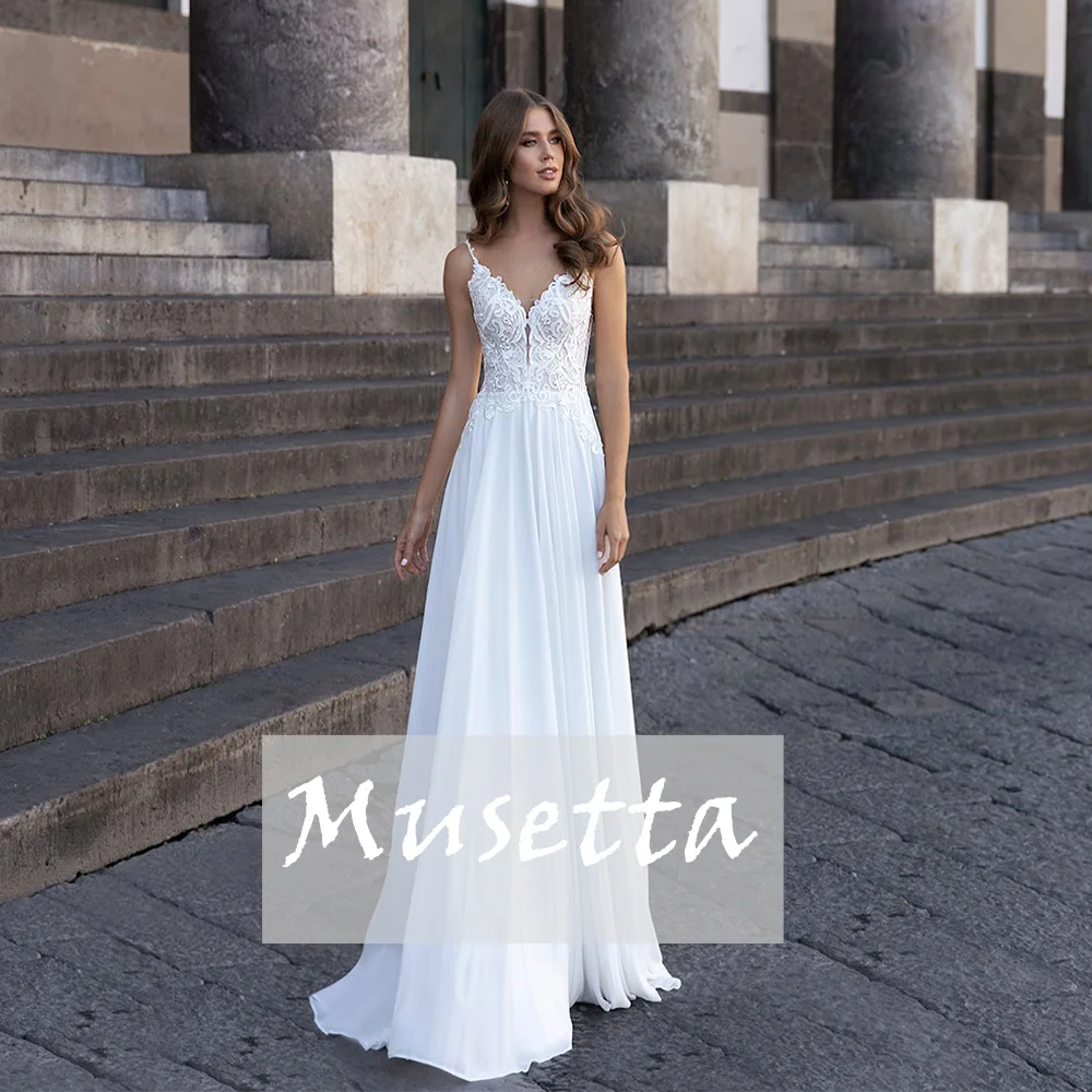 Boho V-Neck Chiffon A-Line Wedding Dress Lace Appliuque Sleeveless Beach Bridal Gowns Backless Floor Length Civil Robe De Mariée
Boho V-Neck Chiffon A-Line Wedding Dress Lace Appliuque Sleeveless Beach Bridal Gowns Backless Floor Length Civil Robe De Mariée