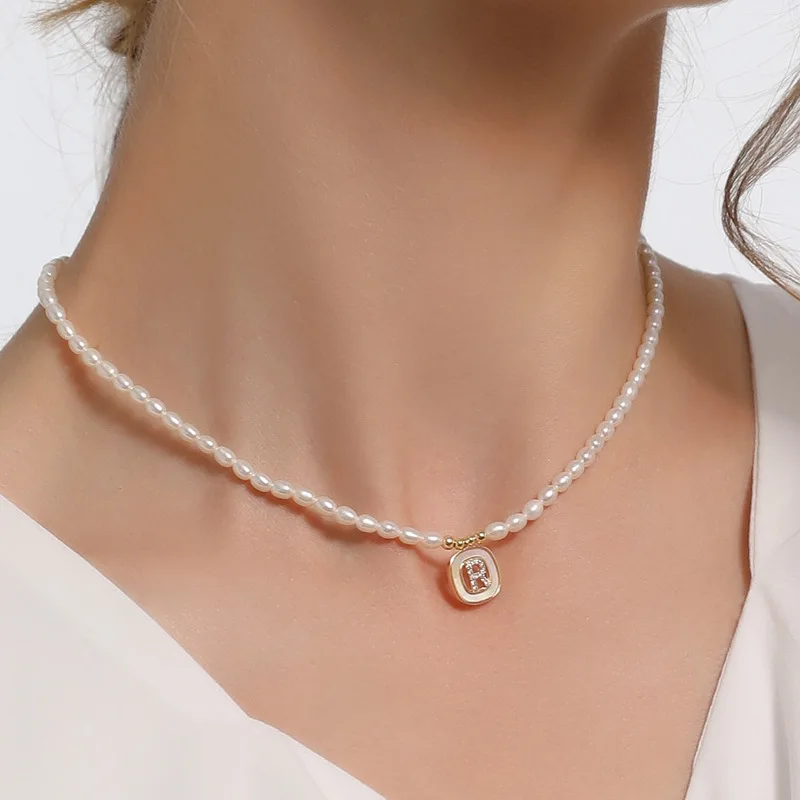 Luxury Natural Freshwater Pearl Necklace for Women Baroque Shiny Initial Letter Charm Pendant Small Rice Pearls Choker Jewelry
Luxury Natural Freshwater Pearl Necklace for Women Baroque Shiny Initial Letter Charm Pendant Small Rice Pearls Choker Jewelry