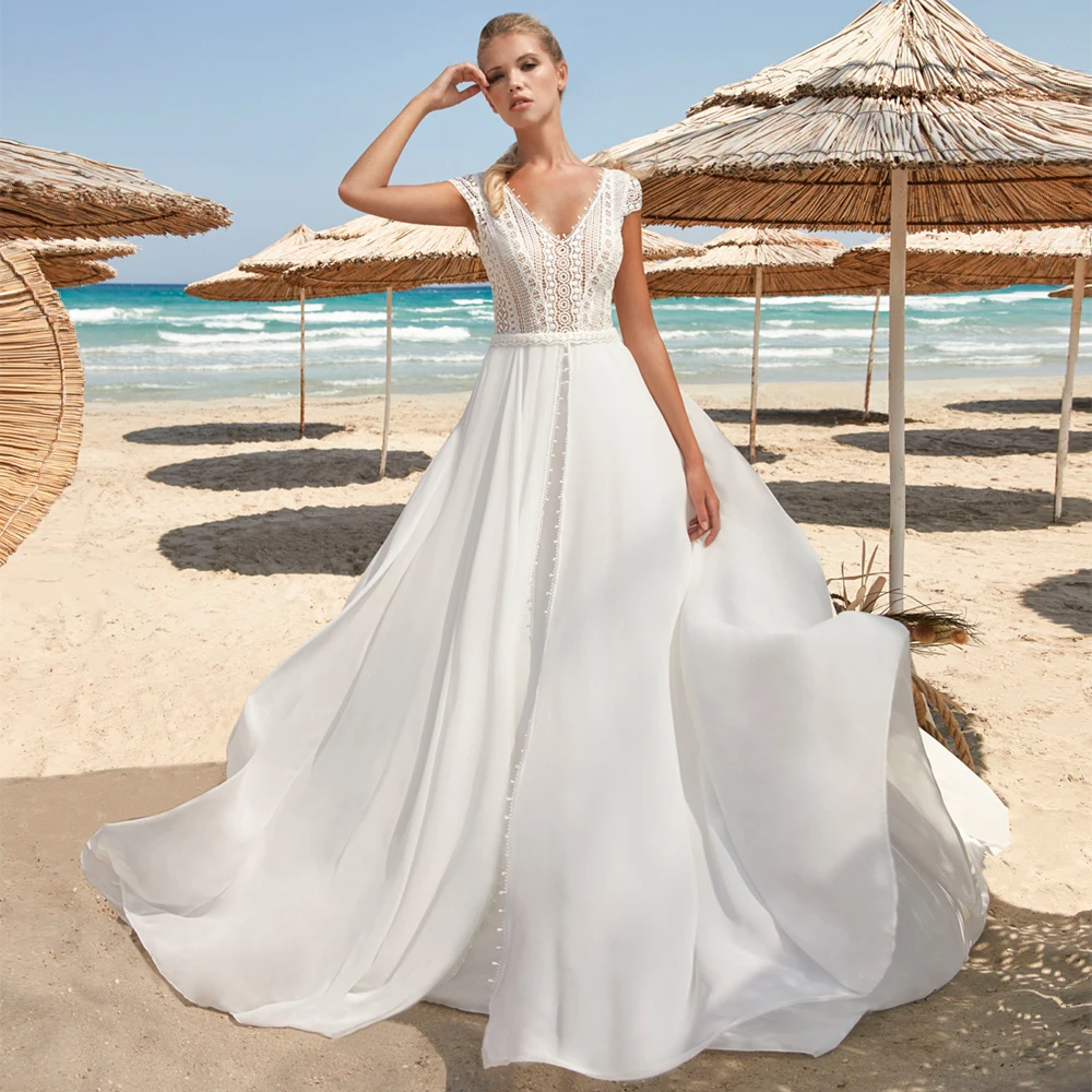 Boho Wedding Dress A Line V Neck Cap Sleeves Backless Summer Beach Wedding Gowns Sweep Train Buttons Elegant Lace Bridal Dresses
Boho Wedding Dress A Line V Neck Cap Sleeves Backless Summer Beach Wedding Gowns Sweep Train Buttons Elegant Lace Bridal Dresses
