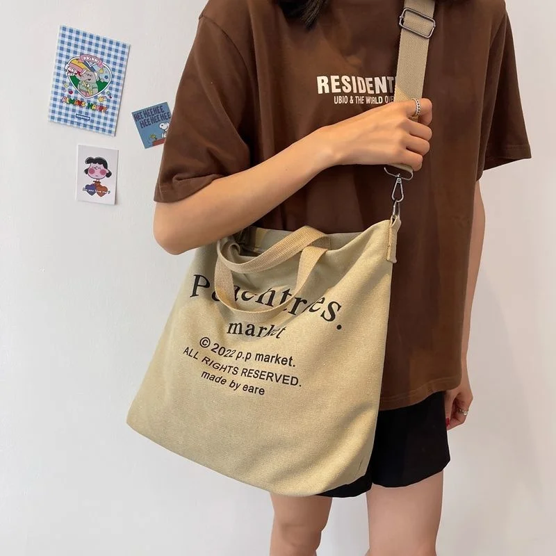 

Retro alphabet canvas bag female student class single shoulder bag large capacity cloth bag Korean version large bag literature
