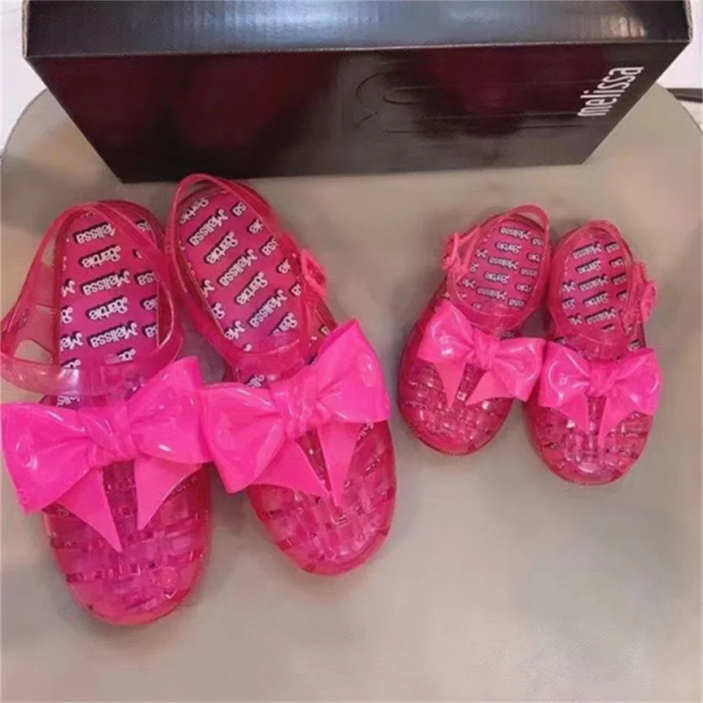 2022 New Melissa Parent-child Beach Shoes Women Girls Bow Weave Hollow Sandals Fashion Soft Sole Non-slip Jelly Shoes
2022 New Melissa Parent-child Beach Shoes Women Girls Bow Weave Hollow Sandals Fashion Soft Sole Non-slip Jelly Shoes