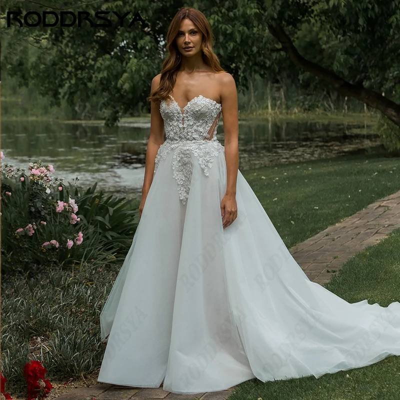 RODDRSYA 2024 Элегантное свадебное платье без бретелек для невесты романтическое Тюлевое платье с открытой спиной платье невесты ТРАПЕЦИЕВИДНОЕ кружевное свадебное платье2024 Элегантное свадебное платье без бретелек дл
RODDRSYA 2024 Элегантное свадебное платье без бретелек для невесты романтическое Тюлевое платье с открытой спиной платье невесты ТРАПЕЦИЕВИДНОЕ кружевное свадебное платье2024 Элегантное свадебное платье без бретелек дл