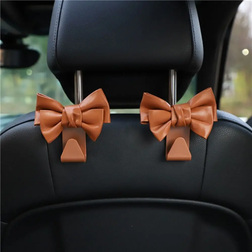 PU Leather Car Seat Back Hook New Car Accessories Bowknot Bowknot Storage Hook Safety Seat Hooks Car
PU Leather Car Seat Back Hook New Car Accessories Bowknot Bowknot Storage Hook Safety Seat Hooks Car