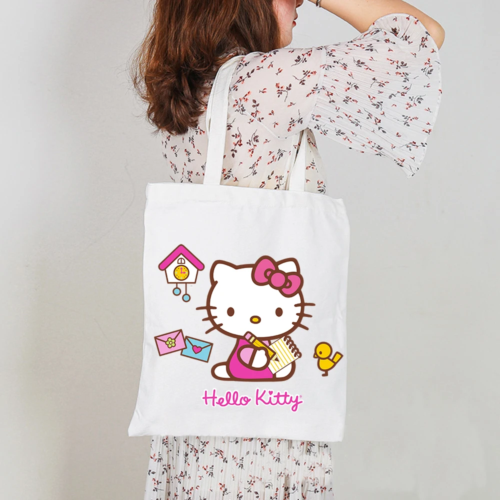 Холщовая женская сумка Hellon Kitty Sanrio с милым котом, повседневные сумки-мессенджеры для студенток, винтажная дамская сумочка на плечо для покуп...
Холщовая женская сумка Hellon Kitty Sanrio с милым котом, повседневные сумки-мессенджеры для студенток, винтажная дамская сумочка на плечо для покуп...