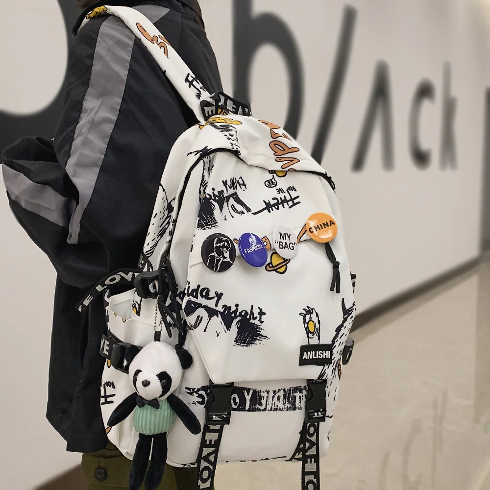 Cool Women Men Graffiti Pattern Trendy Backpack Lady Travel Badge Backpack Harajuku Bag Female Male College Girl Boy Student Bag
Cool Women Men Graffiti Pattern Trendy Backpack Lady Travel Badge Backpack Harajuku Bag Female Male College Girl Boy Student Bag