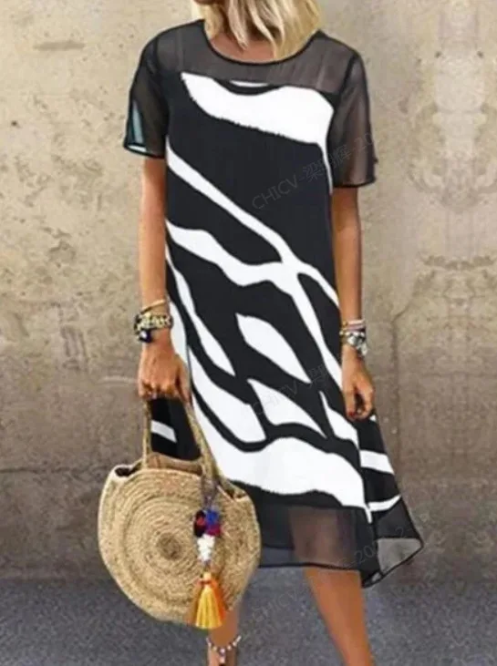 2022 Spring/summer new European and American Chiffon spliced animal print short sleeve dress for women 
2022 Spring/summer new European and American Chiffon spliced animal print short sleeve dress for women