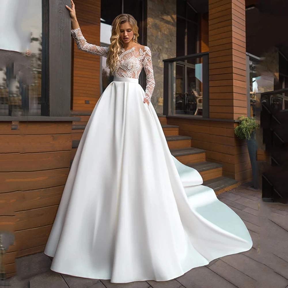 Chic Leaves Lace Wedding Dress F ull Sleeves Illusions Bridal Gowns A-line Satin Button SweepTrain robe de soirée femme فساتين ا
Chic Leaves Lace Wedding Dress F ull Sleeves Illusions Bridal Gowns A-line Satin Button SweepTrain robe de soirée femme فساتين ا