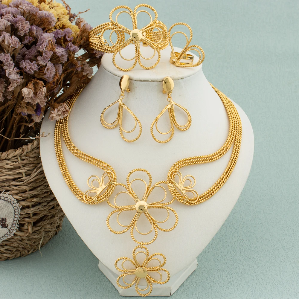 Большой кулон, женский комплект ювелирных изделий, позолоченные серьги 18 К, ожерелье, цветочный браслет, кольцо, полый дизайн, женские свадебные украшения для невесты
Большой кулон, женский комплект ювелирных изделий, позолоченные серьги 18 К, ожерелье, цветочный браслет, кольцо, полый дизайн, женские свадебные украшения для невесты