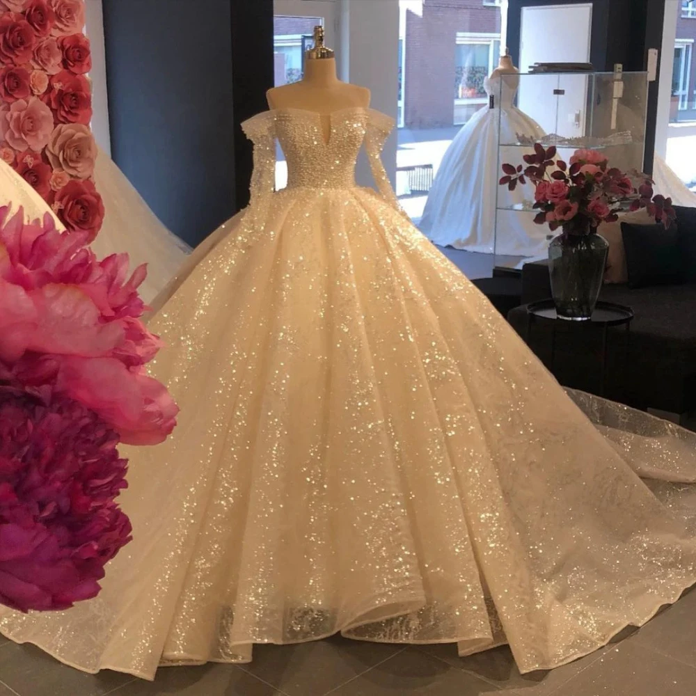 Glitter Sequins Long Sleeves Off The Shoulder Wedding Dresses Ball Gown Pearls Tulle Custom Luxury Bridal Dress Vestido De Novia
Glitter Sequins Long Sleeves Off The Shoulder Wedding Dresses Ball Gown Pearls Tulle Custom Luxury Bridal Dress Vestido De Novia