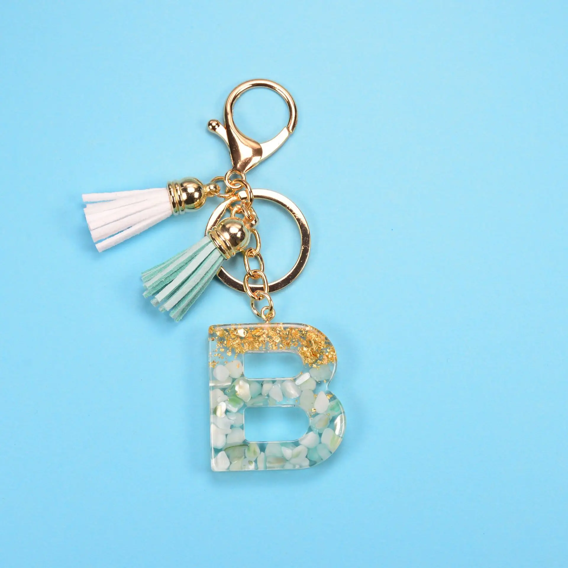New Exquisite 26 Letters Keychain Tassel Bag Pendant Stone Gold Foil Resin Key Ring Men Women Keychains Charms Bag Ornament
New Exquisite 26 Letters Keychain Tassel Bag Pendant Stone Gold Foil Resin Key Ring Men Women Keychains Charms Bag Ornament