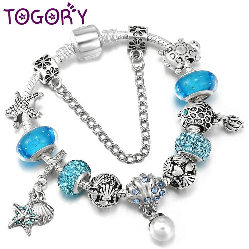 Браслет с подвесками в виде ракушек и рыбок, серебристого цвета
Браслет с подвесками в виде ракушек и рыбок, серебристого цвета