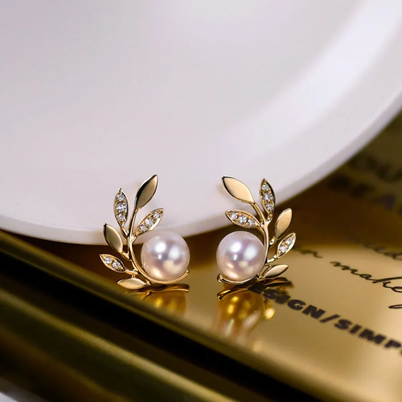 Olive branch-shaped aurora borealis pearl earrings zirconia 18K gold branch leaf earrings premium sense niche silver pin earring
Olive branch-shaped aurora borealis pearl earrings zirconia 18K gold branch leaf earrings premium sense niche silver pin earring