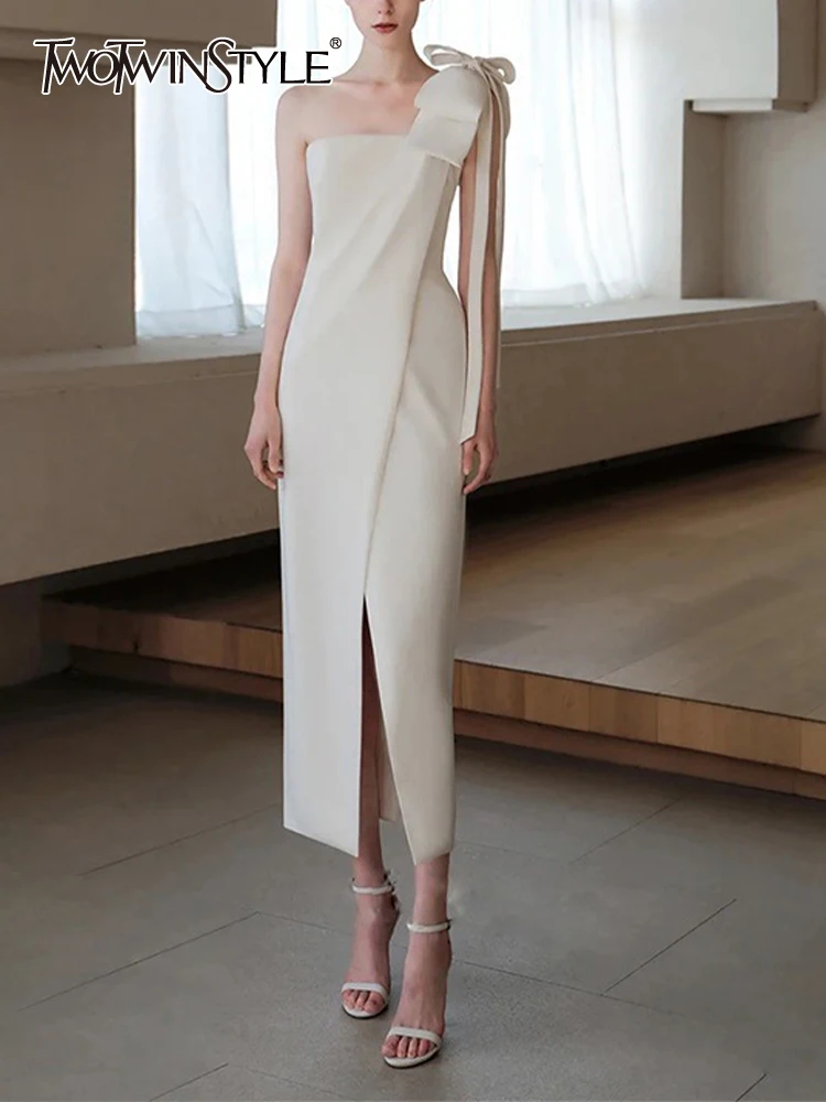 TWOTWINSTYLE Solid Spliced Bowknot Formal Dresses For Women Strapless Sleeveless High Waist Folds Split Irregular Dress Female
TWOTWINSTYLE Solid Spliced Bowknot Formal Dresses For Women Strapless Sleeveless High Waist Folds Split Irregular Dress Female