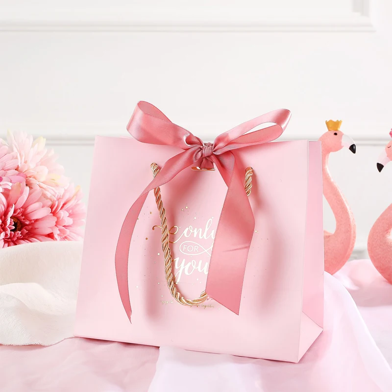 Factory Price Custom Logo Printed Pink Packaging Paper Bag With Handle And Ribbon gift shopping bag
Factory Price Custom Logo Printed Pink Packaging Paper Bag With Handle And Ribbon gift shopping bag