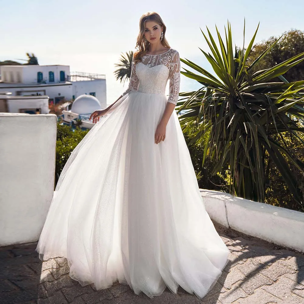 Elegant Wedding Dresses Jewel Three Quarter Sleeve Button Bride Dress Glitter Tulle Lace Appliques Beaded Bridal Gowns For Women
Elegant Wedding Dresses Jewel Three Quarter Sleeve Button Bride Dress Glitter Tulle Lace Appliques Beaded Bridal Gowns For Women