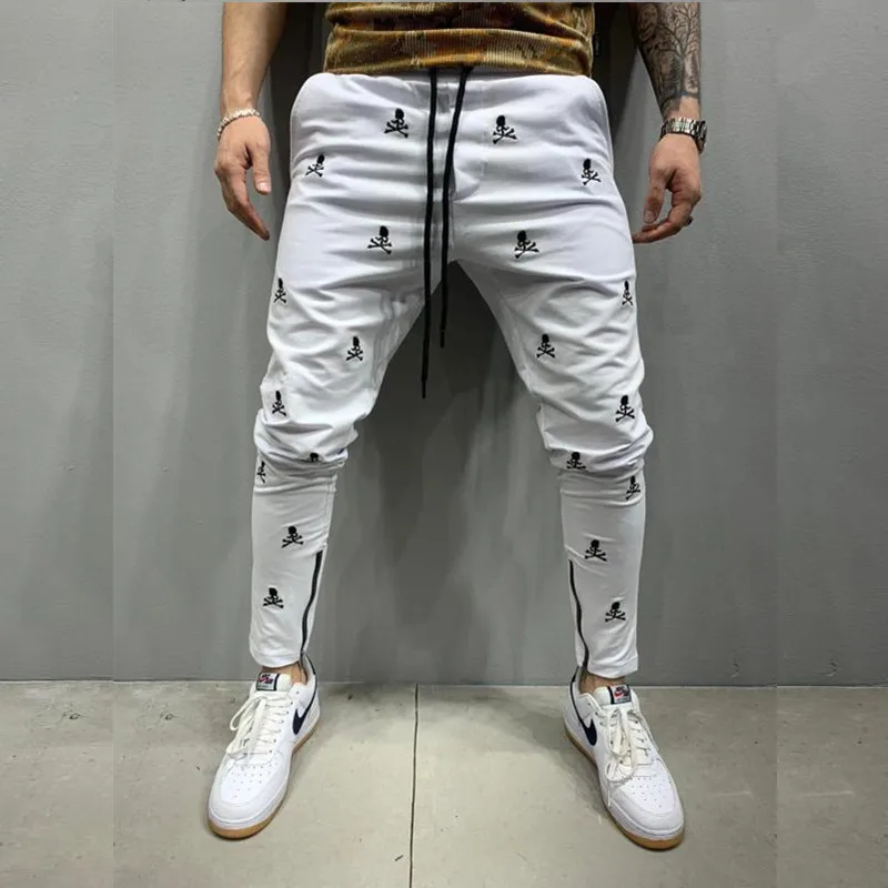 

Мужские новые белые тактические брюки для бега в стиле Харадзюку с вышивкой черепа облегающие повседневные брюки мужские брюки в стиле хип-хоп на молнии для ног
