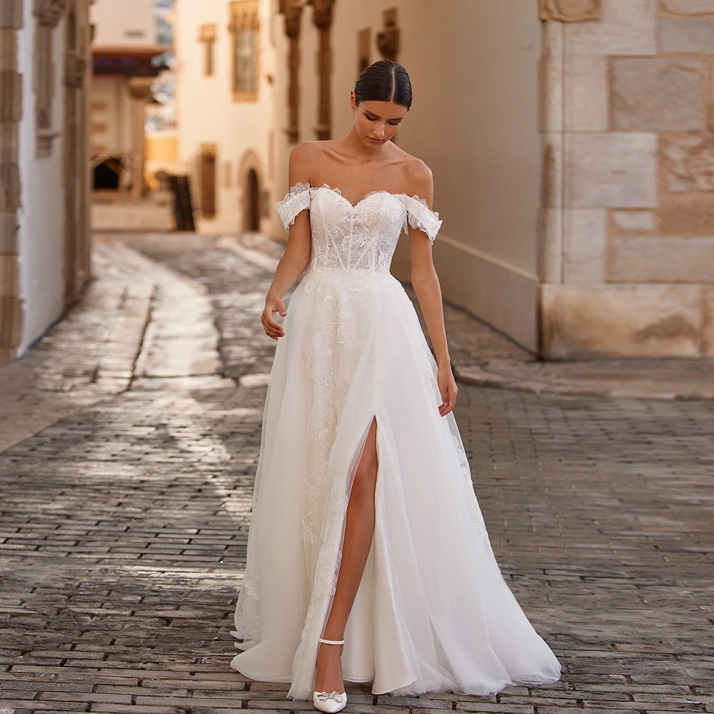 Elegant Ivory Wedding Dresses Off Shoulder Sleeveless A-Line Bridal Gowns Sweep Train Front Slit Tulle Lace Vestidos De Novia
Elegant Ivory Wedding Dresses Off Shoulder Sleeveless A-Line Bridal Gowns Sweep Train Front Slit Tulle Lace Vestidos De Novia