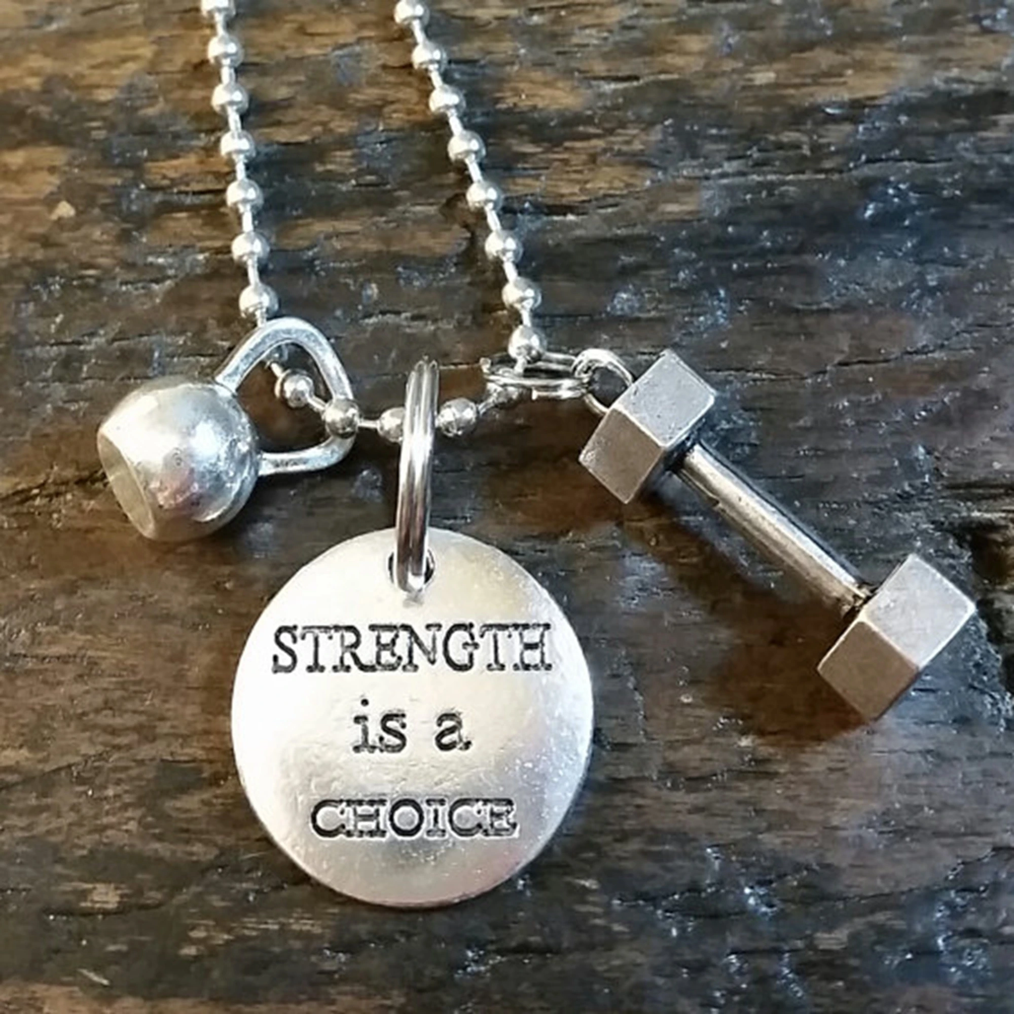 12pcs/lot Strength is a Choice Weightlifting Dumbbell Kettlebell Necklace silver tone
12pcs/lot Strength is a Choice Weightlifting Dumbbell Kettlebell Necklace silver tone