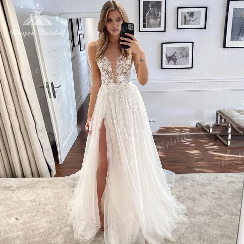 Summer Boho Wedding Dress 2023 Fairy Transparent Deep V-Neck Floral Applique Tulle High Side Slit Bridal Gown Suknia ślubna
Summer Boho Wedding Dress 2023 Fairy Transparent Deep V-Neck Floral Applique Tulle High Side Slit Bridal Gown Suknia ślubna