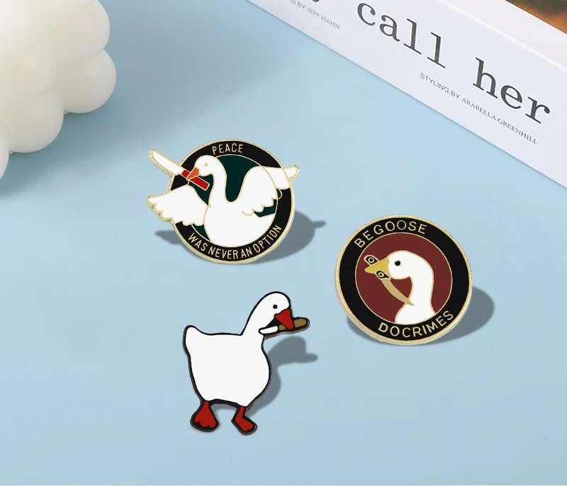 

Cartoon White Goose with Knife Brooches Clothes Lapel Pins Cute Assassin Duck Round Badges Flying Animal in Wings Enamel Jewelry