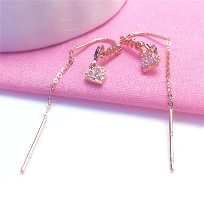 Серьги-подвески женские из розового золота 585 пробы с инкрустированными кристаллами 
Серьги-подвески женские из розового золота 585 пробы с инкрустированными кристаллами