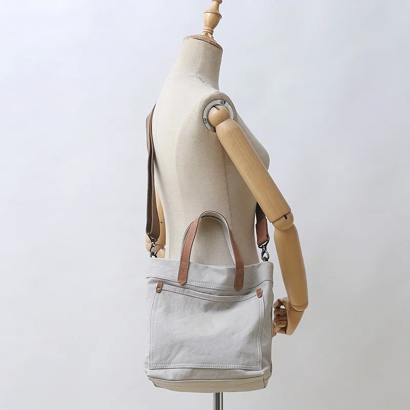 2020 Summer New Canvas Bag with Cowhide Portable Messenger Bag Mori All-match Daily Commuter Messenger Bag
2020 Summer New Canvas Bag with Cowhide Portable Messenger Bag Mori All-match Daily Commuter Messenger Bag