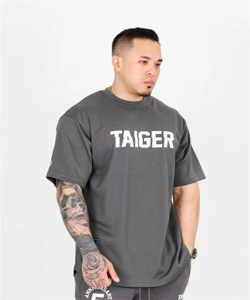 Summer New Mesh Short Sleeve T-Shirt Men's Loose Gym Running Oversized Bodybuilding Sports T-Shirt Fitness hip hop clothing
Summer New Mesh Short Sleeve T-Shirt Men's Loose Gym Running Oversized Bodybuilding Sports T-Shirt Fitness hip hop clothing