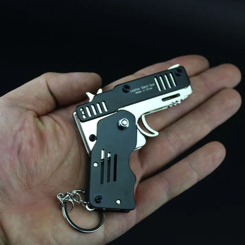 All metal mini can be folded as a key ring rubber band gun children's gift toy six bursts of rubber toy pistol toy gun
All metal mini can be folded as a key ring rubber band gun children's gift toy six bursts of rubber toy pistol toy gun