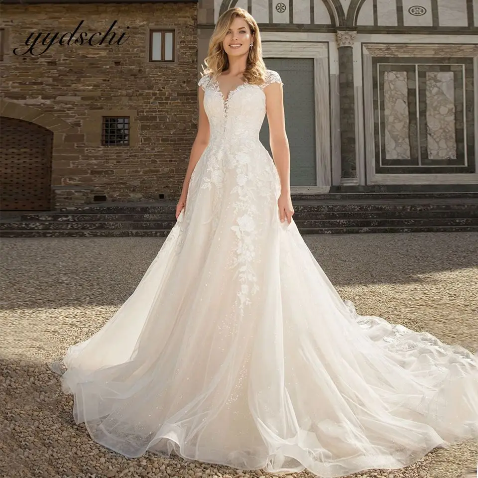 2022 New Scoop Neck Wedding Dress Lace Appliques A-Line Lace Up Bridal Gown Court Train Illusion Sparkly Elegant Dress For Women
2022 New Scoop Neck Wedding Dress Lace Appliques A-Line Lace Up Bridal Gown Court Train Illusion Sparkly Elegant Dress For Women