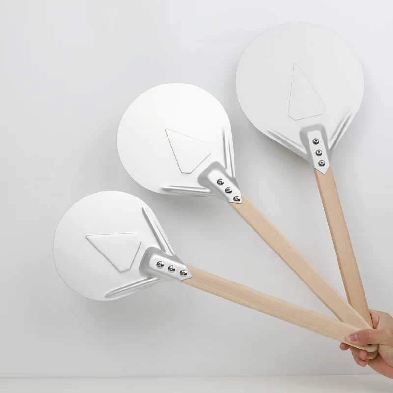 Pizza Turning small Pizza Peel Paddle Short round Pizza Tool Non Slip wooden Handle 7 8 9 inch Perforated Pizza Shovel Aluminum
Pizza Turning small Pizza Peel Paddle Short round Pizza Tool Non Slip wooden Handle 7 8 9 inch Perforated Pizza Shovel Aluminum