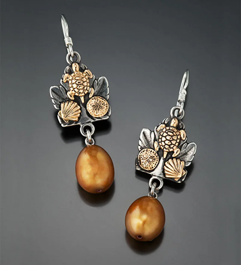 Bohemian Pearl Earrings Retro Creative Two-color Golden Turtle Flower Shell Pendant Earrings Jewelry
Bohemian Pearl Earrings Retro Creative Two-color Golden Turtle Flower Shell Pendant Earrings Jewelry