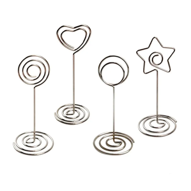 10pcs Heart/Star/Round Shape Metal Photo Clip Wedding Signs Wedding Table Number Stand Place Card Menu Holder Party Table Décor 
10pcs Heart/Star/Round Shape Metal Photo Clip Wedding Signs Wedding Table Number Stand Place Card Menu Holder Party Table Décor