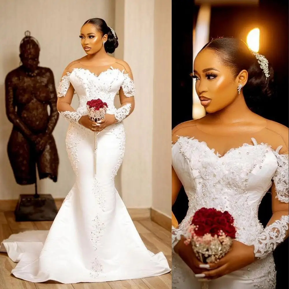 2022 Sexy African Arabic Satin Mermaid Wedding Dresses Jewel Neck Illusion Crystal Beaded Long Sleeves Button Back Court Train
2022 Sexy African Arabic Satin Mermaid Wedding Dresses Jewel Neck Illusion Crystal Beaded Long Sleeves Button Back Court Train