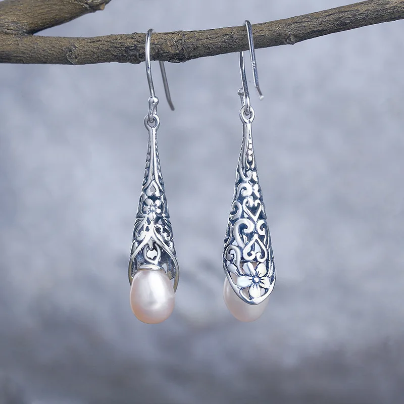 S925 sterling silver earrings Baroque long pearl pendant Thai silver simple retro European and American fashion earrings
S925 sterling silver earrings Baroque long pearl pendant Thai silver simple retro European and American fashion earrings