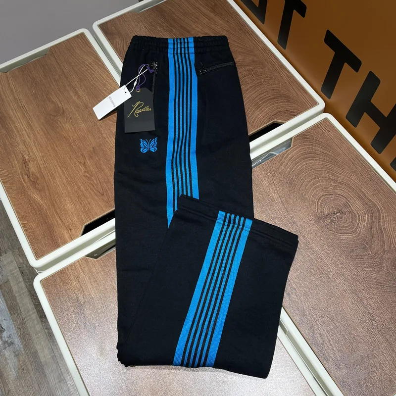 Men Women Casual Trousers Embroidered Butterfly Blue Webbing Pants High Street Needles Sweatpants
Men Women Casual Trousers Embroidered Butterfly Blue Webbing Pants High Street Needles Sweatpants